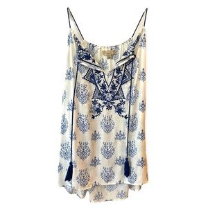 Flowy tissue paper tunic top. White with blue flowers. Size medium.